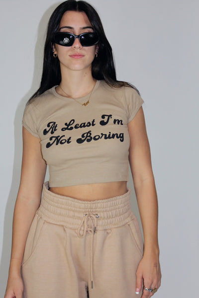 Load image into Gallery viewer, At least I&#39;m Not Boring cotton soft baby tee screen printed in New York City
